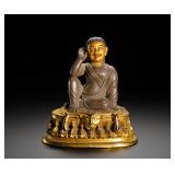 A GILDED BRONZE STATUE OF MILAREPA FROM THE...