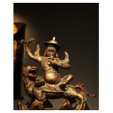 A LION-RIDING GUARDIAN STATUE FROM THE QING...