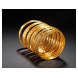 GILDED BRONZE NINE-RING ENGRAVED BRACELET OF...