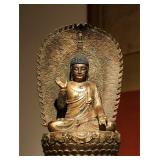 A FINELY CAST BRONZE BACKLIT BUDDHA OF THE MING...