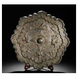 A LARGE BRONZE MIRROR OF THE TANG DYNASTY WITH...
