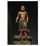 A WOODCARVING OF THE IMMOVABLE KING OF THE QING...