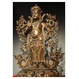 A GILDED BRONZE STANDING STATUE OF MAITREYA...