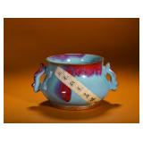 A ROSE-PURPLE DOUBLE-EARED INCENSE BURNER FROM...