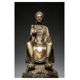 A SILVER-PLATED BRONZE STATUE OF SAKYAMUNI...