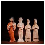 A SET OF FOUR TANG DYNASTY PAINTED MALE AND...