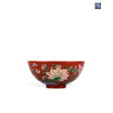 A CORAL RED GROUND POLYCHROME BOWL MADE BY...