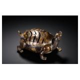 A HAN DYNASTY COPPER INLAID GOLD BASALT...