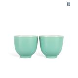 A PAIR OF CUPS WITH TURQUOISE GREEN GLAZE FROM...