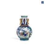 A SMALL DOUBLE-EARED ORNAMENTAL VASE OF THE...