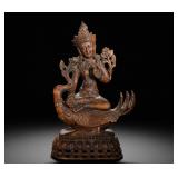 QING DYNASTY AGARWOOD STATUE OF TARA RIDING A...