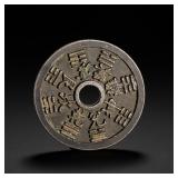 SILVER COIN WITH A ROUND HOLE AND EIGHT...