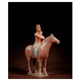 PAINTED POTTERY FIGURINES OF HORSE-RIDING...