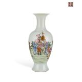 A PINK AND WHITE PORCELAIN VASE OF GUANYIN IN...