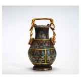 BRONZE WITH TURQUOISE AND GILDED CHAIN-CARRYING...