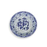 A BLUE AND WHITE PLATE WITH SEA AND GRAPE...