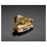 COPPER GILT EMBOSSED FLORAL SET WITH SIX-EYED...