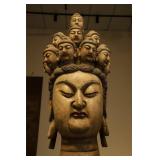 A WOODCARVING OF THE ELEVEN-FACED GUANYIN...