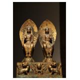A GILDED BRONZE STATUE OF TWO BUDDHAS SITTING...