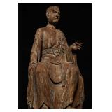 A SEATED STATUE OF THE ARHAT MADE OF NANMU WOOD...
