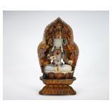 A SILVER-GILDED WHITE JADE INLAID MANJUSRI...