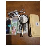 sewing kit, magnifying glass, misc