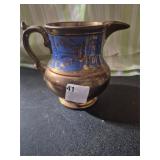 Copper lusterware creamer pitcher