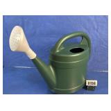 Green Plastic Watering Can with White Rose
