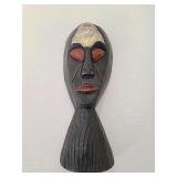 Tribal Face Statue with Red Eyes