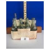 Six glass Coca-Cola bottles with carrier / NO SHIP
