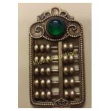 Chinese abacus pendant with inlaid green gem