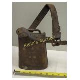 antique cowbell with leather strap