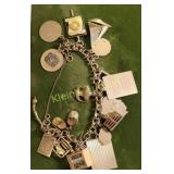 1960's 14K gold charm bracelet 64 grams!