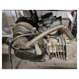  Yamaha PW50 or a similar 50cc horizontal-cylinder engine
