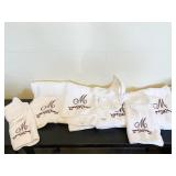 4 BATH AND 4 WASH CLOTHES AND 2 MONOGRAMED "M"