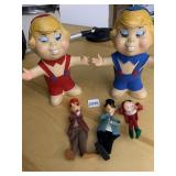 TWO PLASTIC BANKS BY ODMYY AND FELT DOLLS