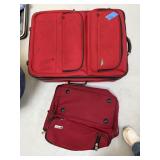 RED ROLLING SUITCASE AND A DUFFEL BAG