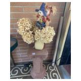 STONE PILLAR AND DRIED HYDRANGEAS IN VASE