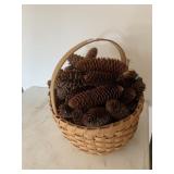 WOVEN BASKET FILLED WITH PINECONES