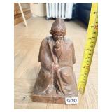 CARVED STONE SCULPTURE MAN W/ FRUIT TO HIS MOUTH