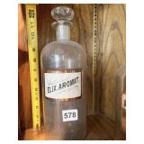 1 APOTHECARY JAR WITH GLASS LABEL GROUND STOPPER
