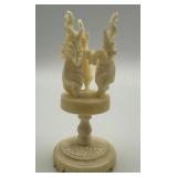 VINTAGE HAND-CARVED BONE ELEPHANTS ON A STAND,