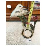 SCULPTURE THAT GENTLY ROCKS WITH A BREEZE TAGS ON