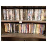 2 FULL SHELVES OF DVDS, SOME CASES EMPTY