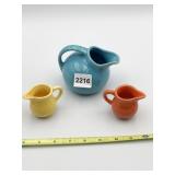 FIESTA WATER PITCHER AND TWO CREAMERS
