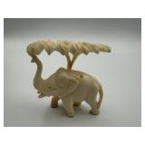 CARVED BONE ELEPHANT STANDING BENEATH A TREE, 2
