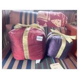 TWO DECORATIVE PILLOWS GIFT SHAPED WITH GOLD BOWS