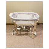 FISHER PRICE TRAVEL BASSINET AND WOOD TUMMY TIME