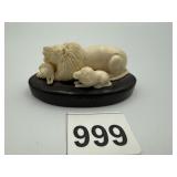 ANTIQUE CARVED BONE SCULPTURE OF A LION WITH