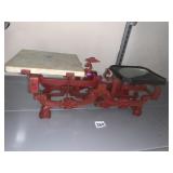 RED MARKET SCALE PAINTED CAST IRON W/ BRASS PAN